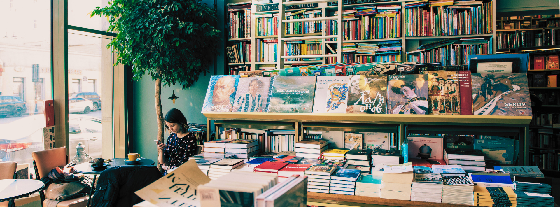 A Bookstore with a woman at coffee shop